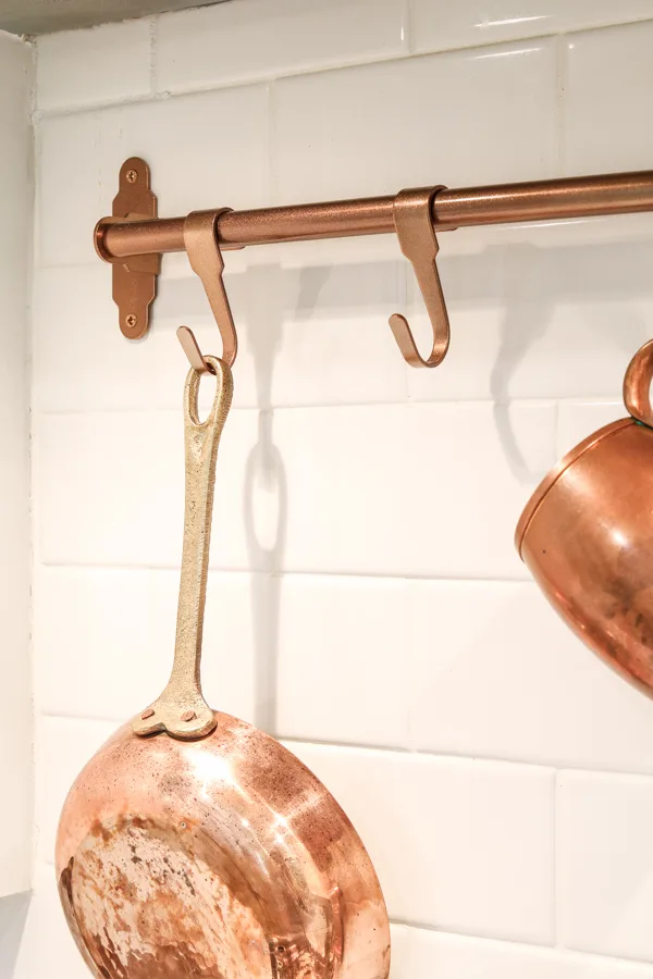 Copper pot rack for over a stove