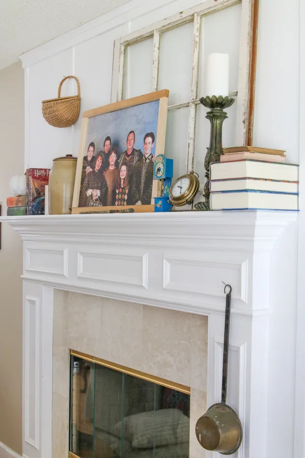 Fireplace mantel decorated with items like the Weasley burrow in the movie Harry Potter
