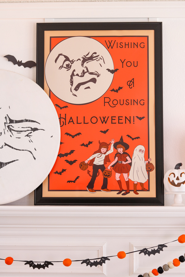 Vintage Halloween printable with moon face, bats and trick or treat kids on an orange background