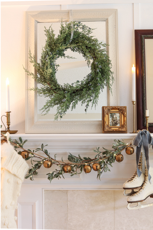mirror with wreath on mantel