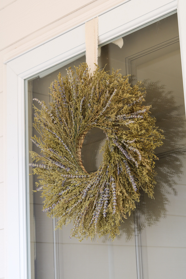 Hanging a wreath on a glass door