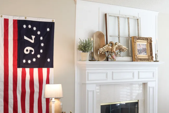 Bennington flag hanging on a wall by my fireplace mantel