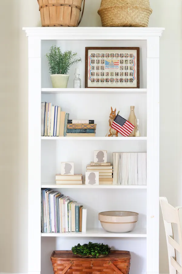 Decorating a bookcase with vintage 4th of July decorations