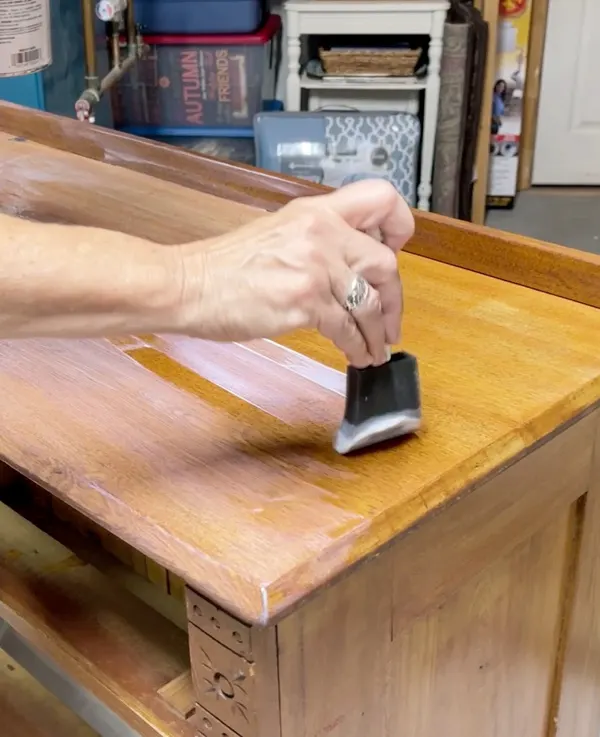Adding sealant to freshly stained wood furniture