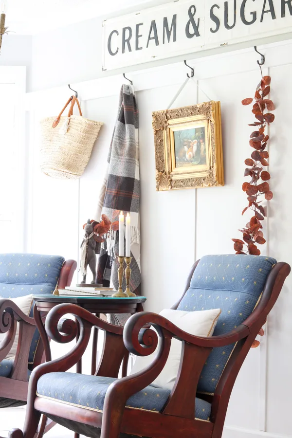 Add fall colors with blankets and throw hanging them on a wall