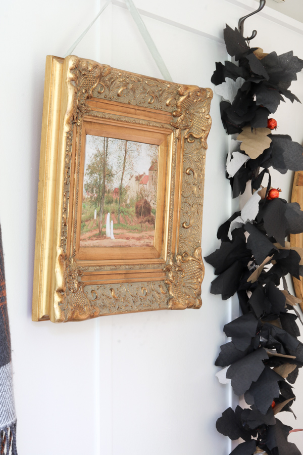 Paper DIY Halloween decorations of a vintage museum art printable with hand painted ghosts