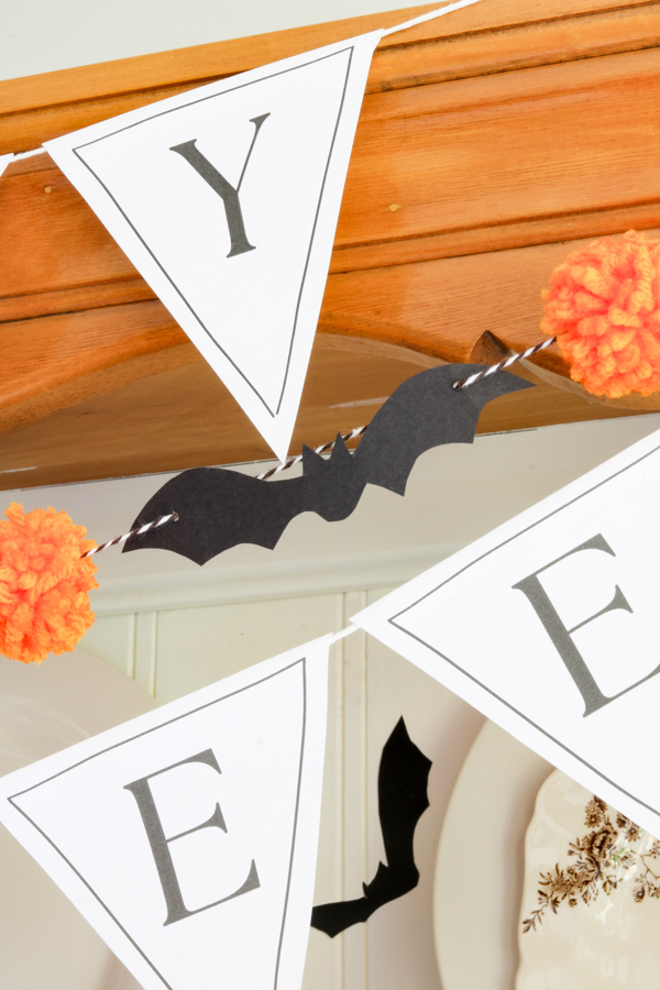 Black bat and pom pom garland diy and Happy Halloween pennant banner printable.