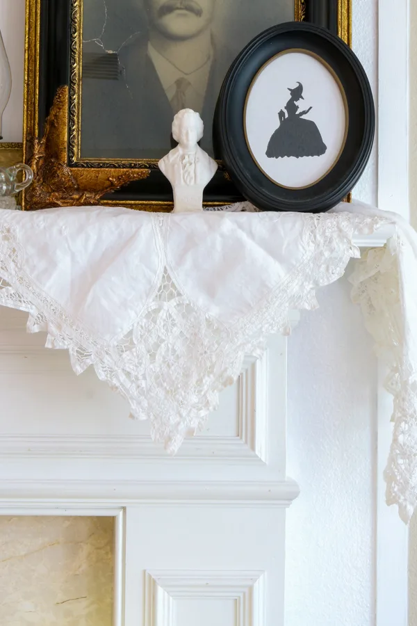 Halloween mantel decoration using a lace table cloth