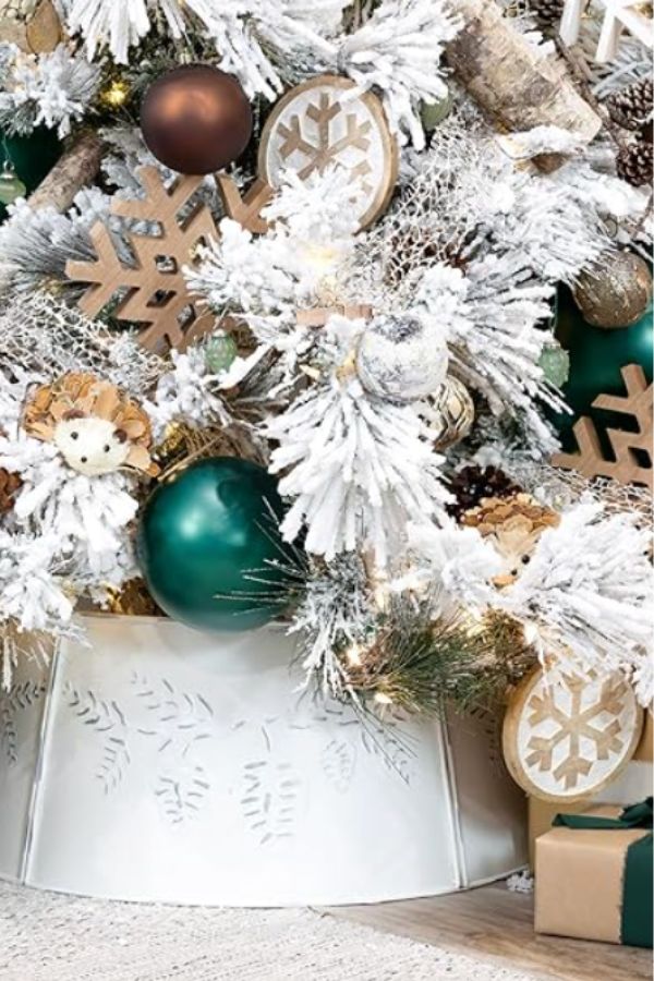 White metal Christmas tree collar with pine cone design