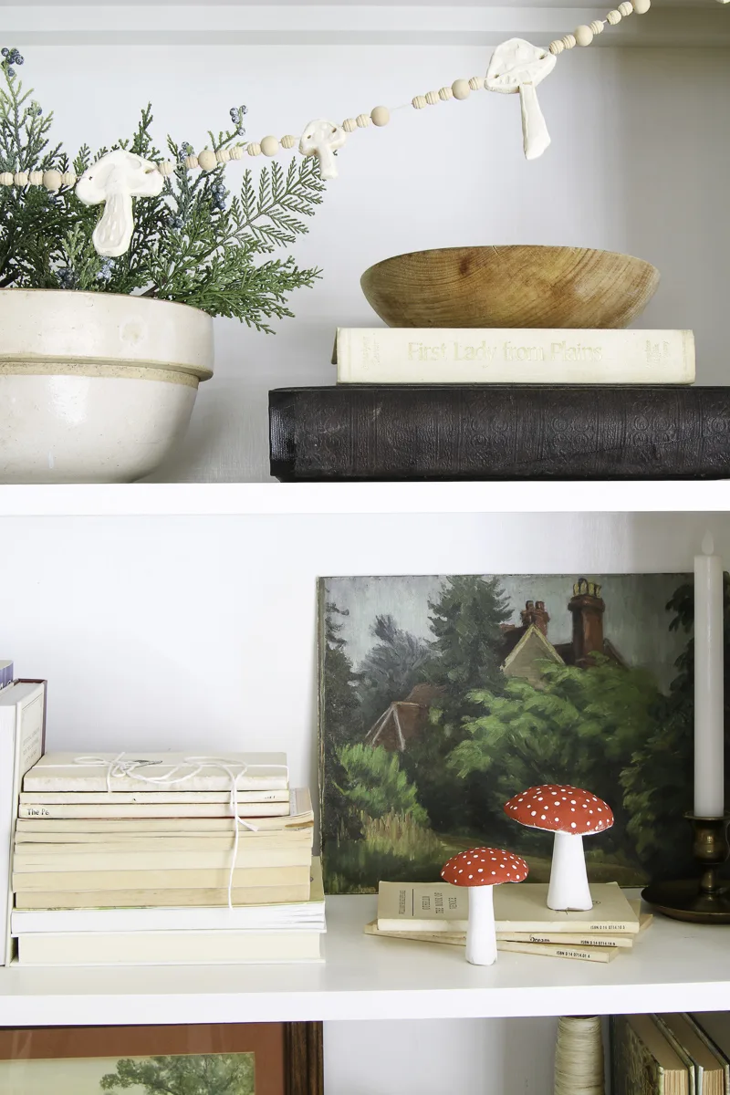 Decorating a bookcase with clay red and white mushrooms