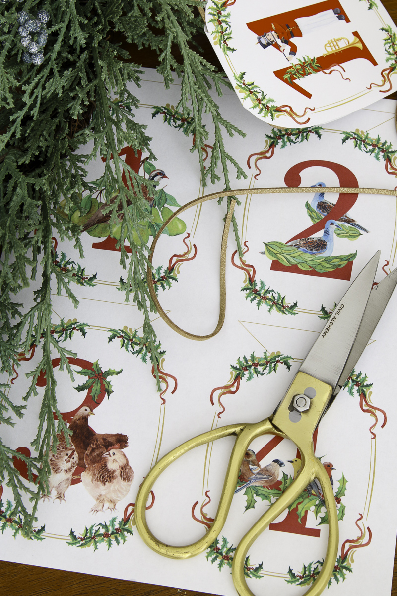 Materials to make a 12 Days of Christmas garland with paper