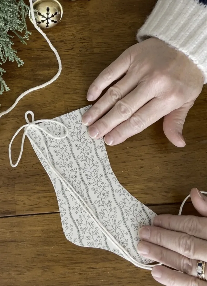 Add a twine bow through the advent calendar printable stocking loo[