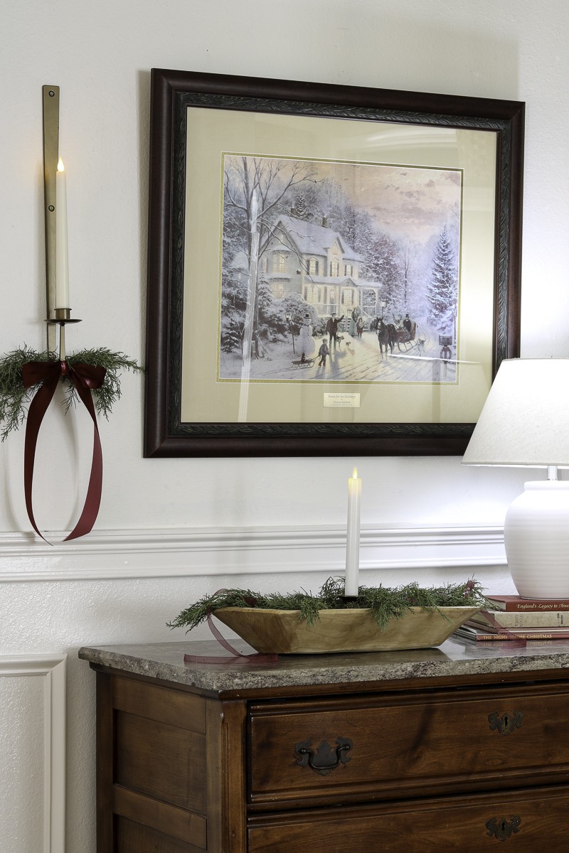 Decorating an entryway with ribbon for Christmas