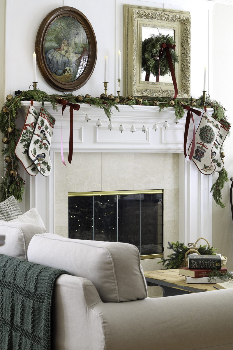little women christmas burgundy and gold color scheme fireplace mantel