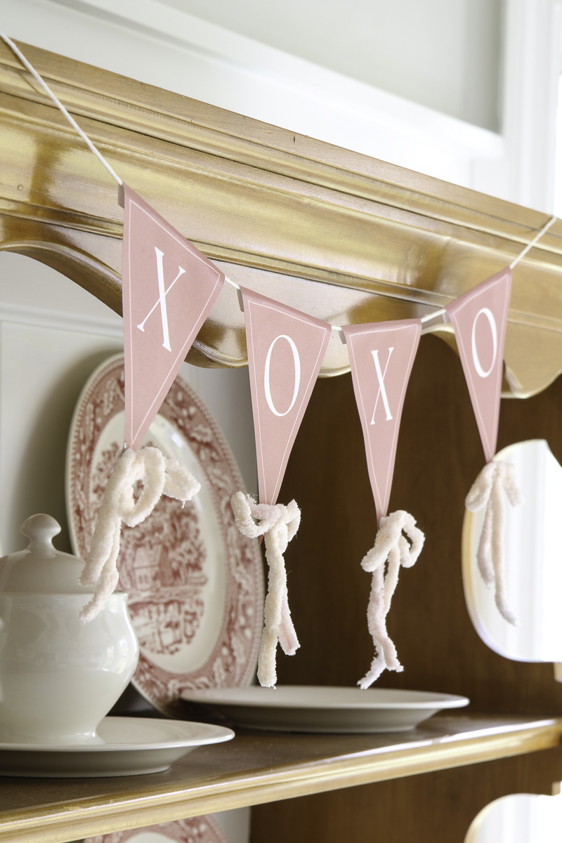 Decorating with ribbon on a pennant garland