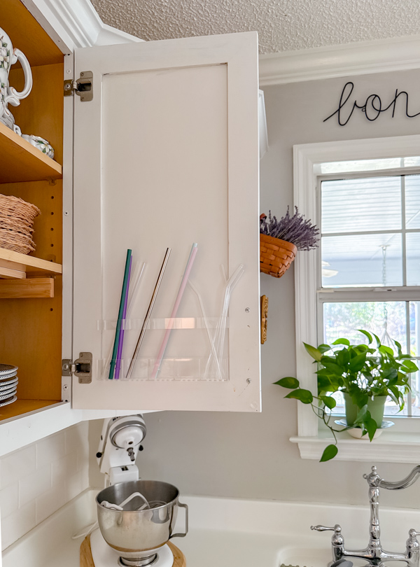 Amazon straw organizer behind a cabinet door