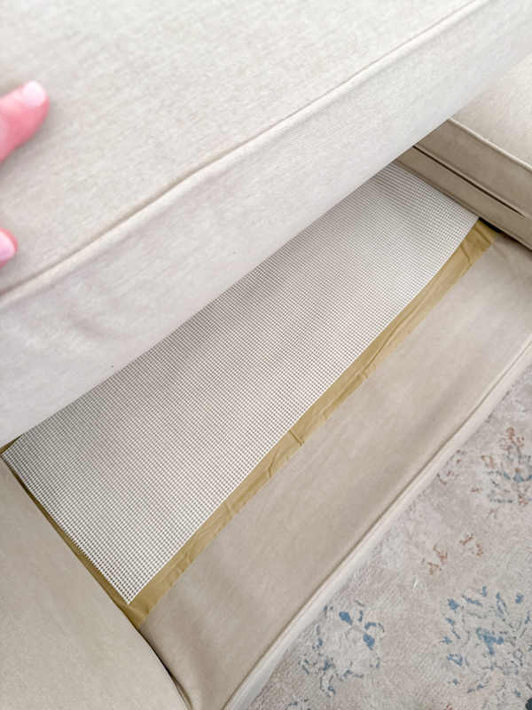 Cabinet liner used to secure Pottery Barn slipcover.