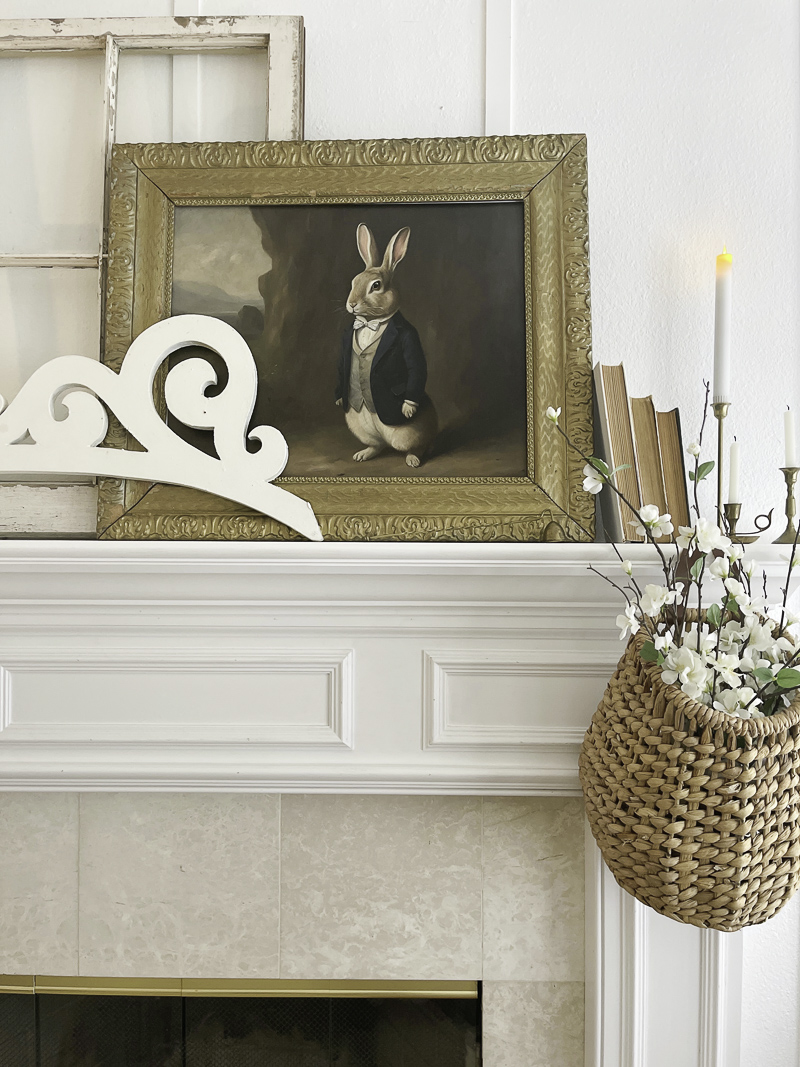 Anthropomorphic rabbits art on fireplace mantel