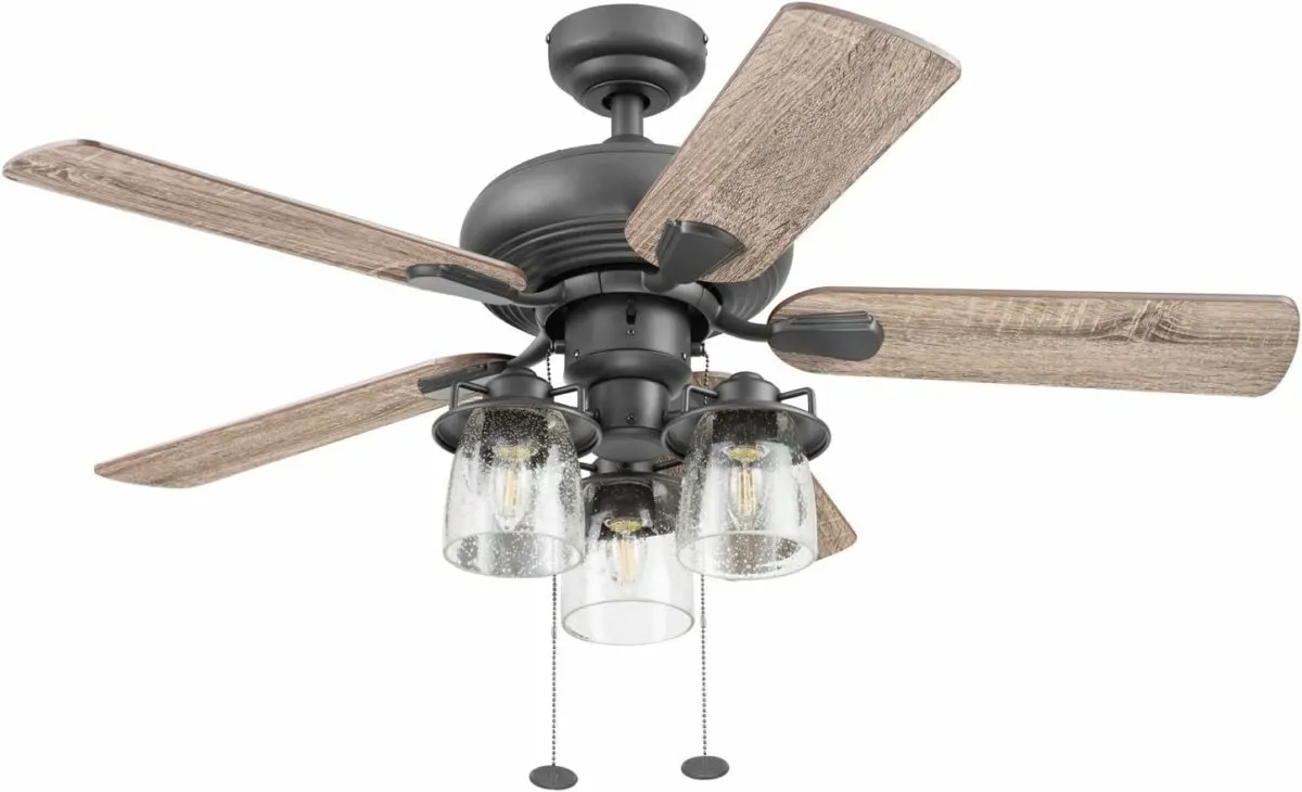 Classic modern farmhouse ceiling fan with weathered light wood blades and metal and seeded glass lights