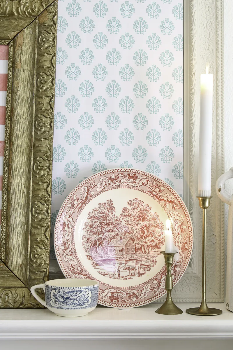 Patriotic mantel decorating using old Currier and Ives dishes