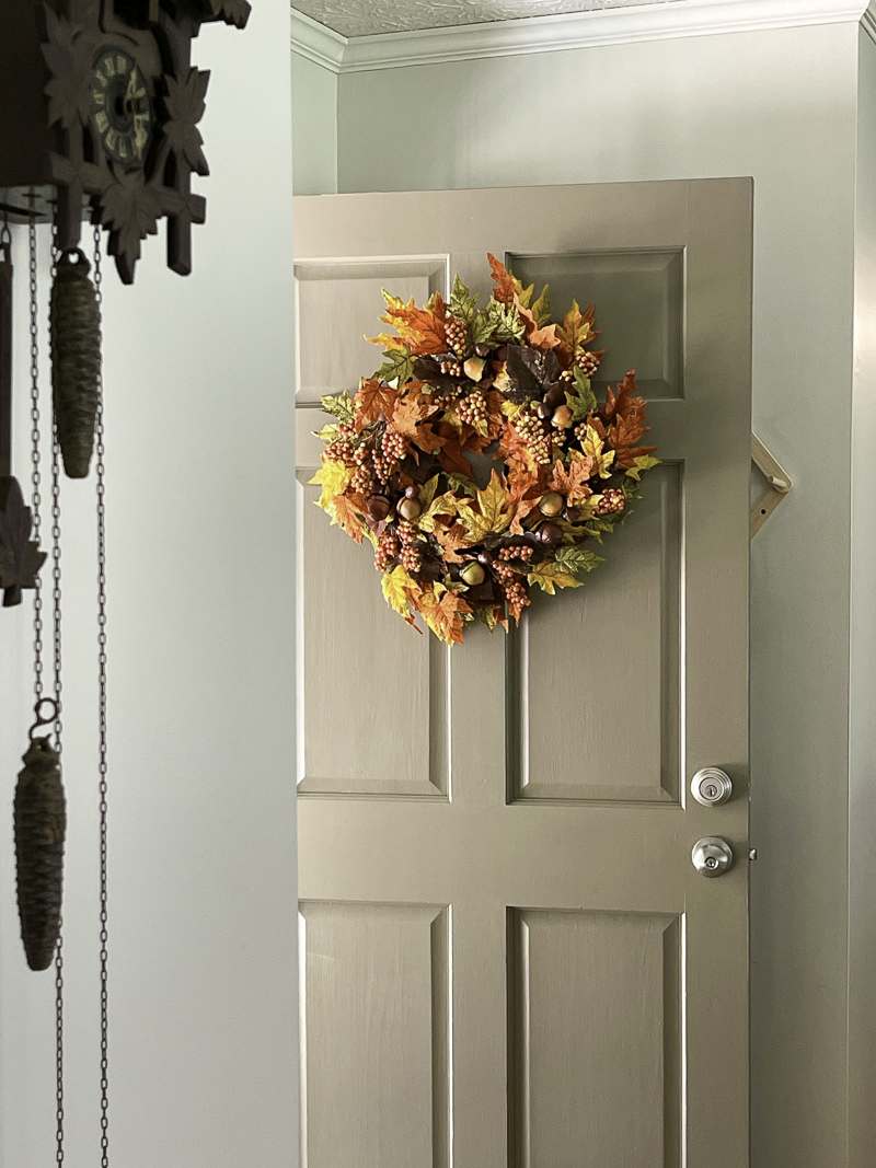 Decorating the front door with orange and copper for fall