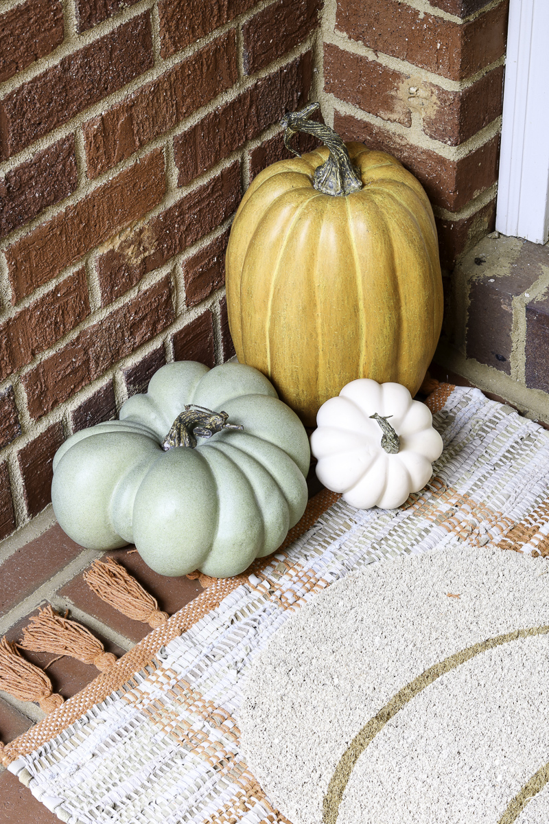 Front porch pumpkin decor ideas in a corner of a porch