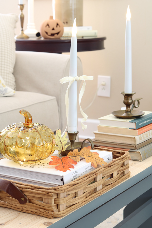 neutral and orange fall decor ideas on the coffee table bench