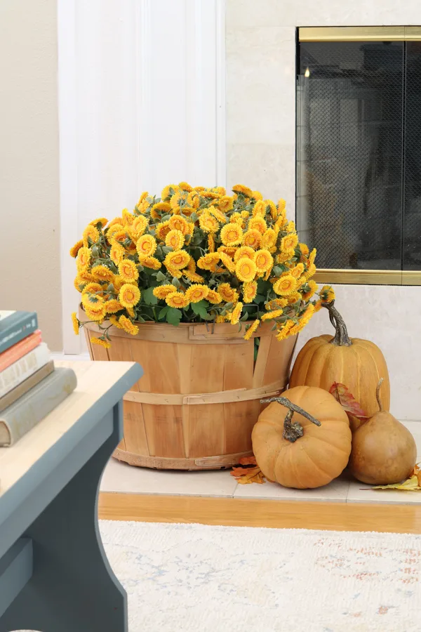 neutral and orange fall decor ideas on the hearth