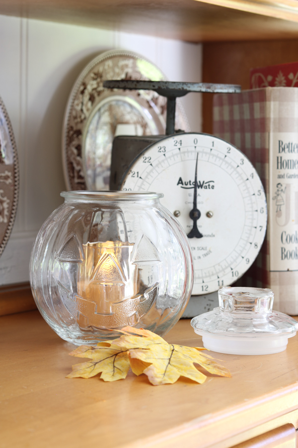 Fall decor ideas on the hutch with a Libbey vintage glass jack o lantern holding a candle