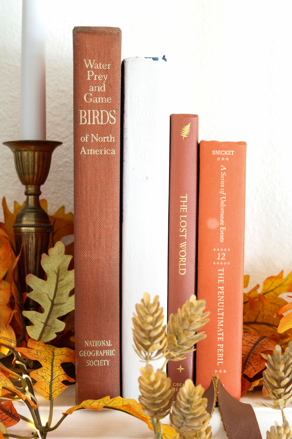 neutral and orange fall decor ideas using old books