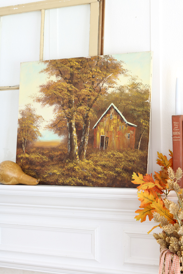 neutral and orange fall decor ideas using thrifted autumn art