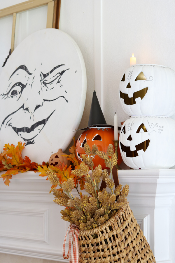 Halloween decorating with Jack o lanterns on the fireplace mantel