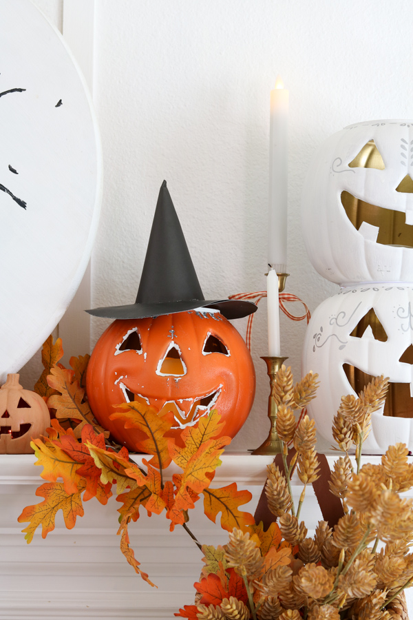 Halloween decorating with Jack o lanterns with witch hats