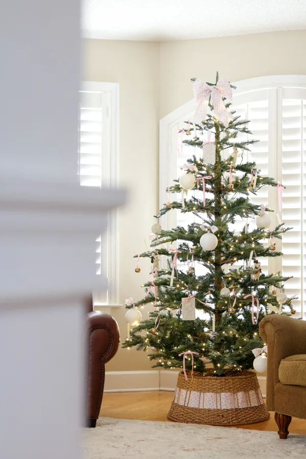 Decorated Christmas tree with fabric bow on top