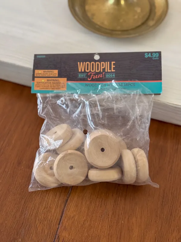 Wood toy wheels for a DIY Scalloped Wood Tray project.