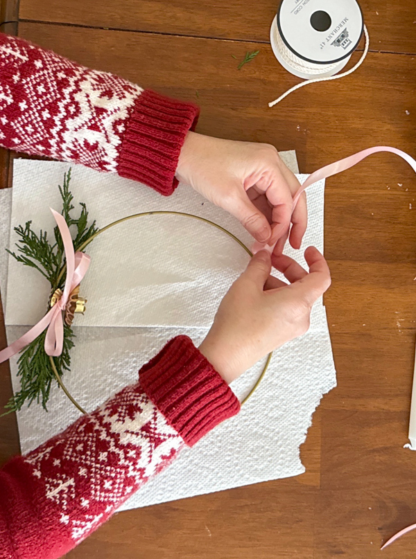 tie a ribbon around the top of the ring to hang it