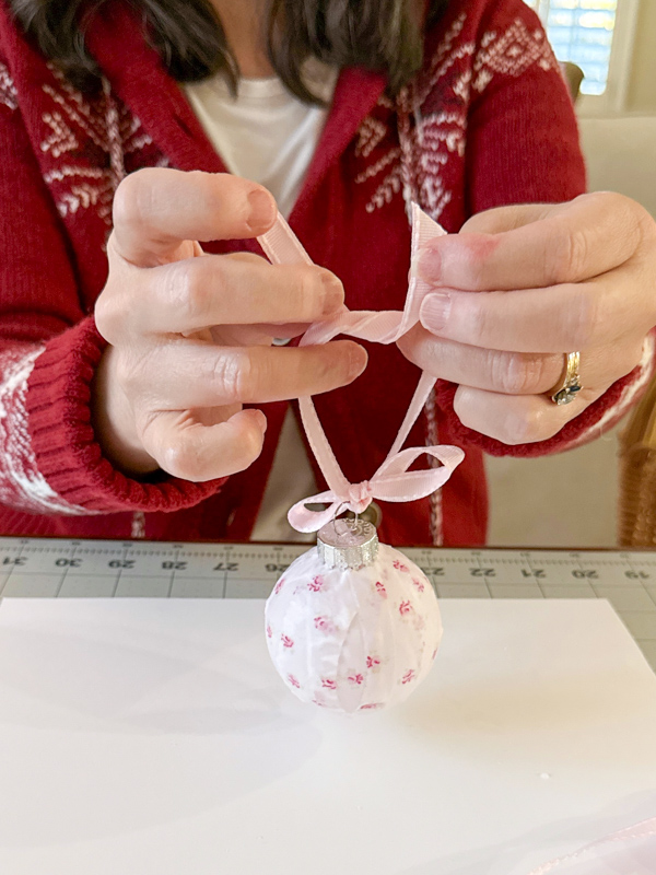 Tie ends of ribbon together to make hanger