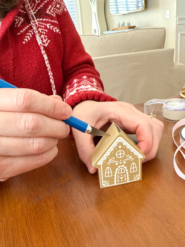 use an xacto knife to cut a slit in the roof