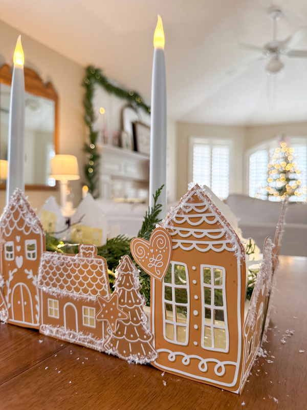 Paper gingerbread village centerpiece with candles