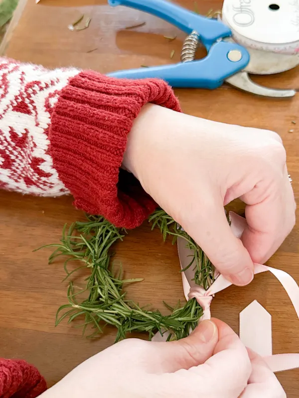 tie a bow around the wreath with ribbon