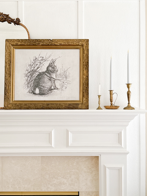 A great gift idea for a home decor lover. Printable sketched bunny in a gold frame on a fireplace mantel.