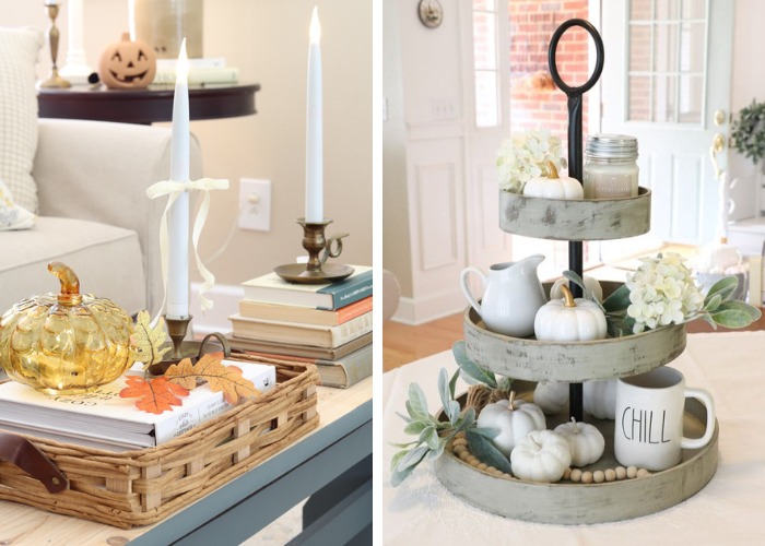 Fall tray decor ideas.  On the left, is a basket tray with books on the bottom, brass candle stick holder with taper candle, glass pumpkin with fairy lights inside and a sprig of leaves.  On the right is a tiered tray with a jar candle on top, white hydrangea and a small white pumpkins on the top layer.  Second layer is a white creamer pitcher, white hydrangea and small white pumpkin and bottom layer is a Rae Dunn mug, more white pumpkins, sprig of lambs ear and a wooden set of beads.