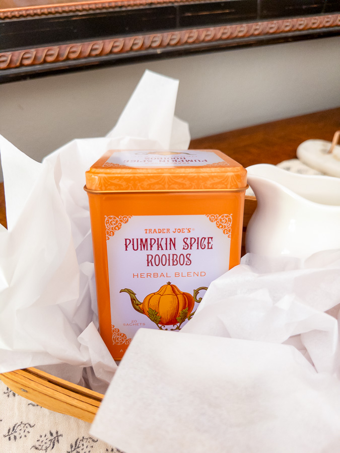 Tea lover housewarming gift basket with Trader Joe’s tea, honey, and thrifted cream and sugar