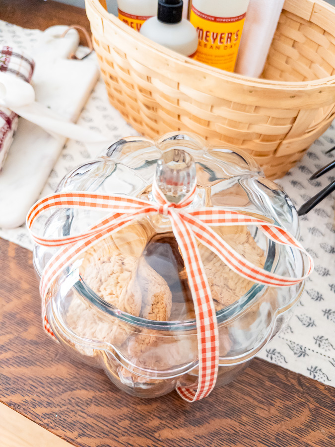 DIY cookie jar gift idea with homemade cookies, ribbon, and seasonal jar for new neighbors
