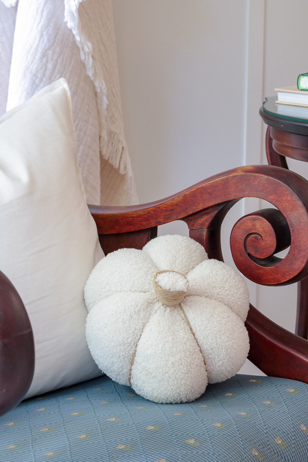 Sherpa pumpkin pillow in chair