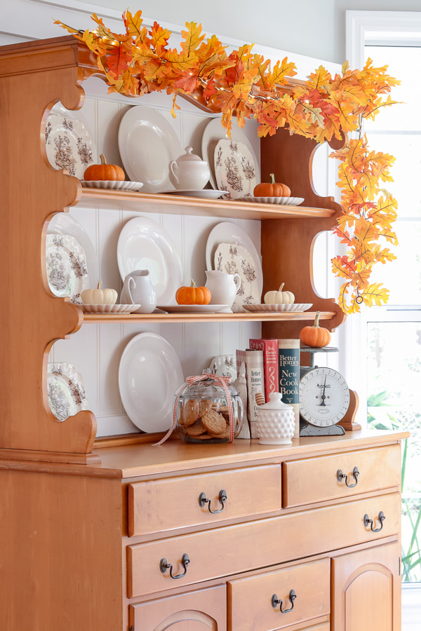 fall hutch decorating with pumpkins