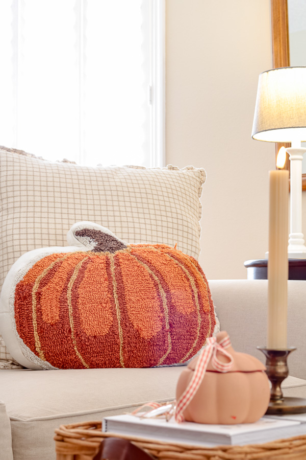Large pumpkin pillow on sofa