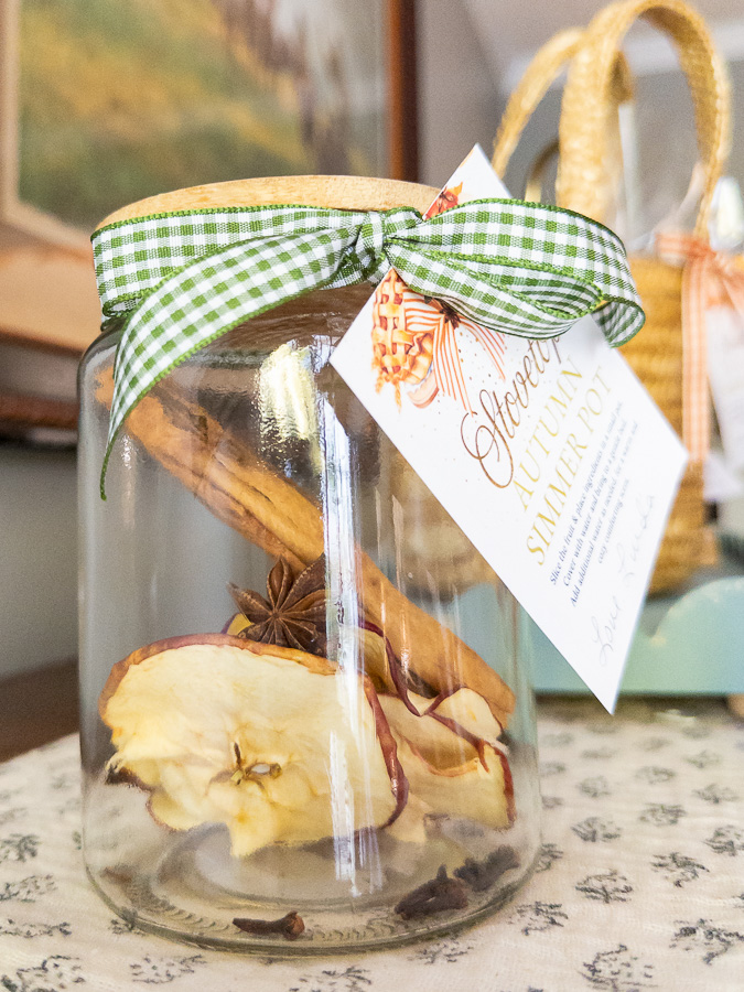 Mason jar simmer pot gift with orange slices, cranberries, and cinnamon sticks