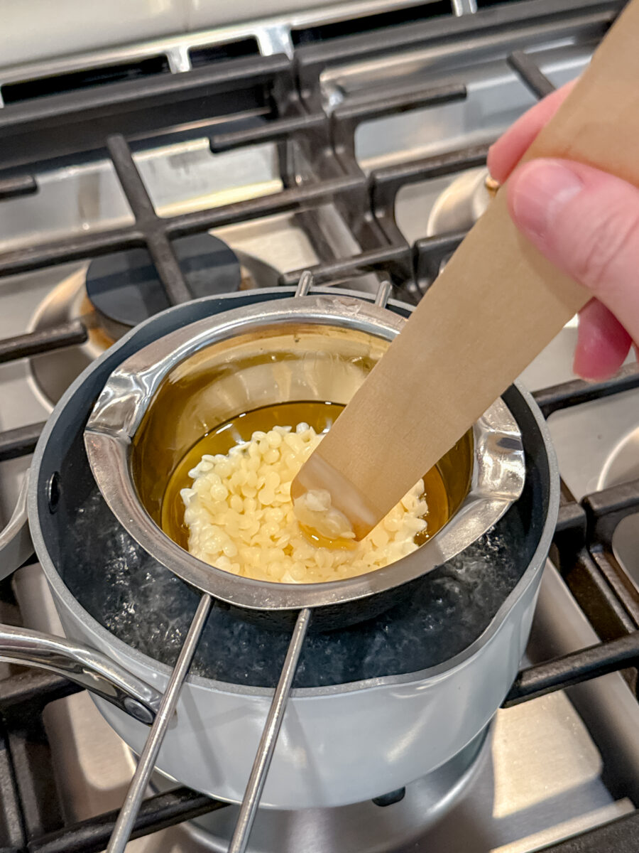 Beeswax pellets melting on a double boiler
