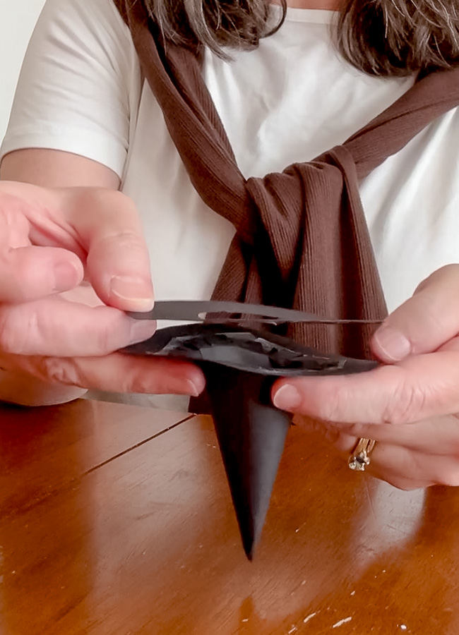 Adding the brim to make a small paper witch hat